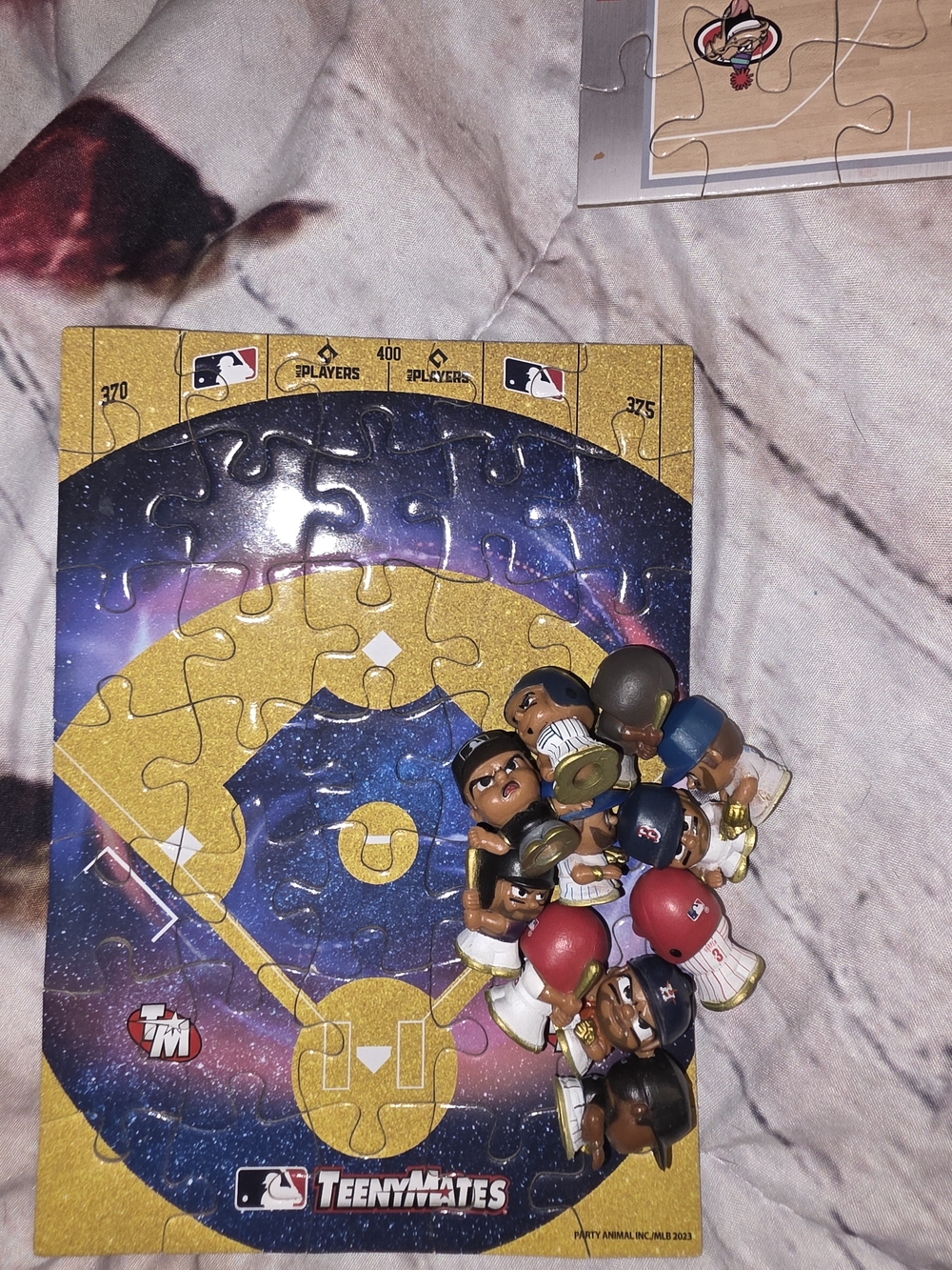 MLB, NBA, and NFL Teeny mates figures and puzzles for fields.